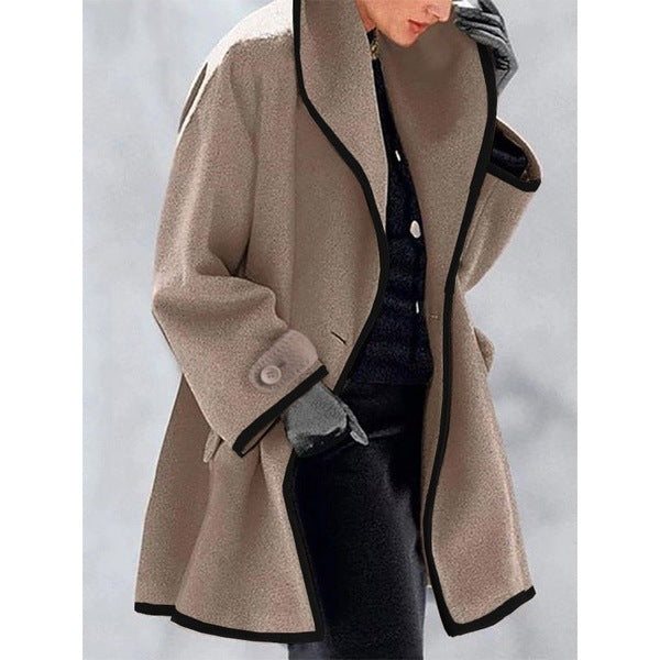 Women's loose fit coat with bold contrast piping trim, wide collar, elegant contemporary silhouette