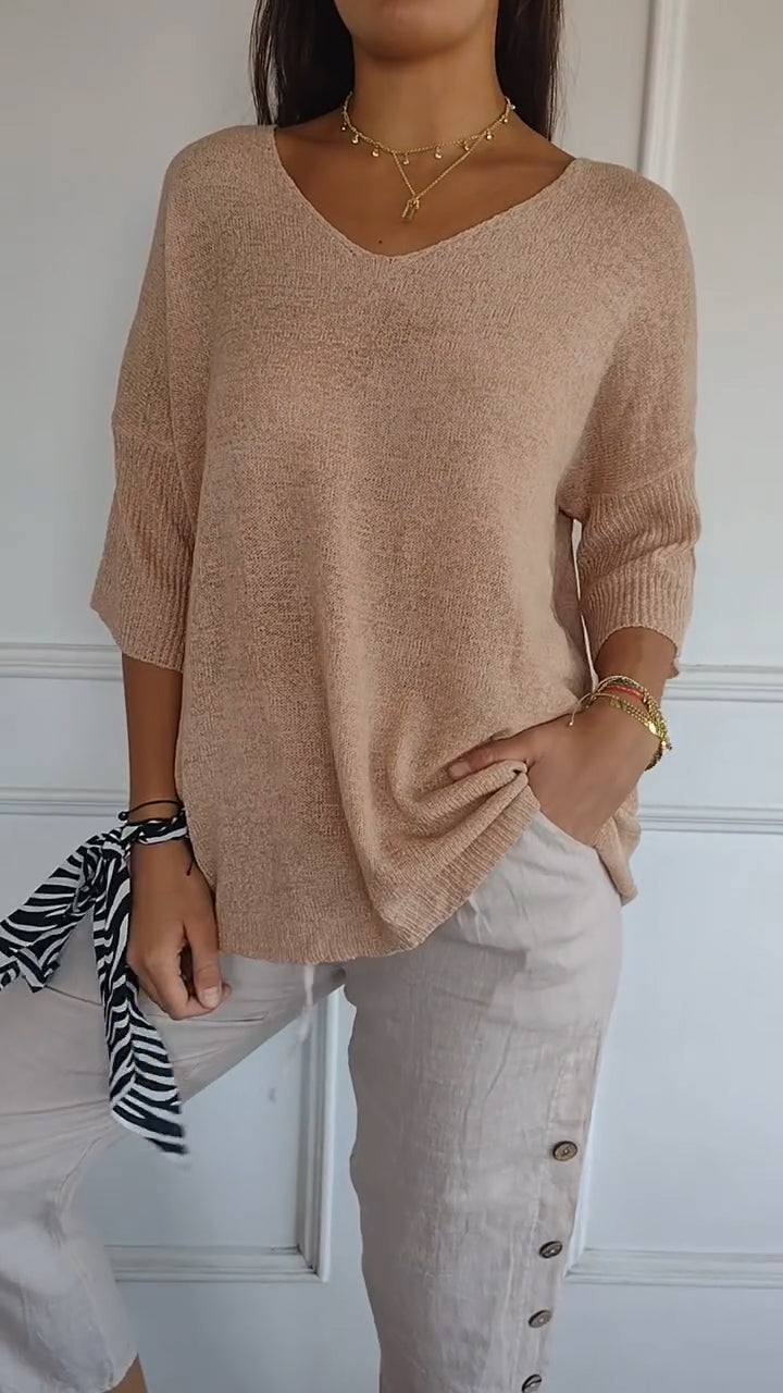 Women's longline loose fit tunic top in casual style with flattering V-neck for everyday comfort