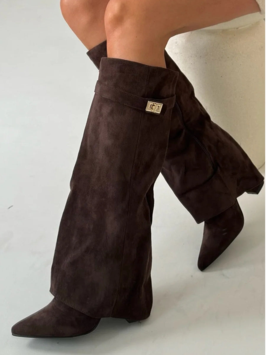 Women's black slouchy thigh-high boots with pointed toe and foldover shaft for elegant chic style