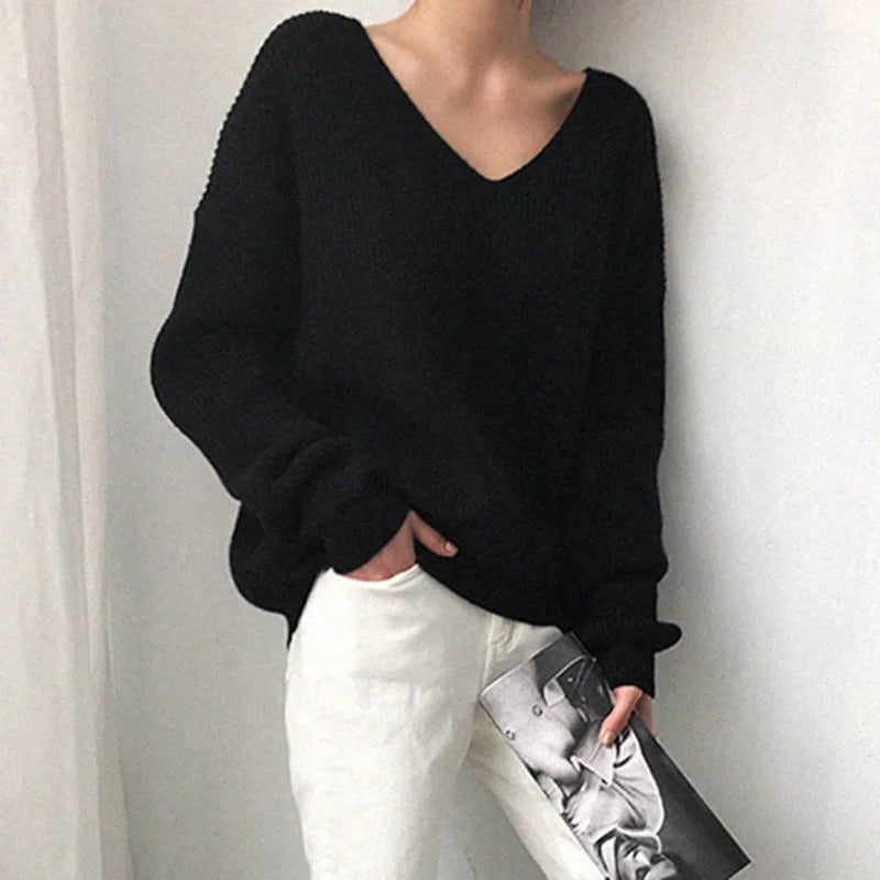 Women's chunky knit V-neck sweater in soft neutral tones, cozy oversized pullover with timeless elegant fit
