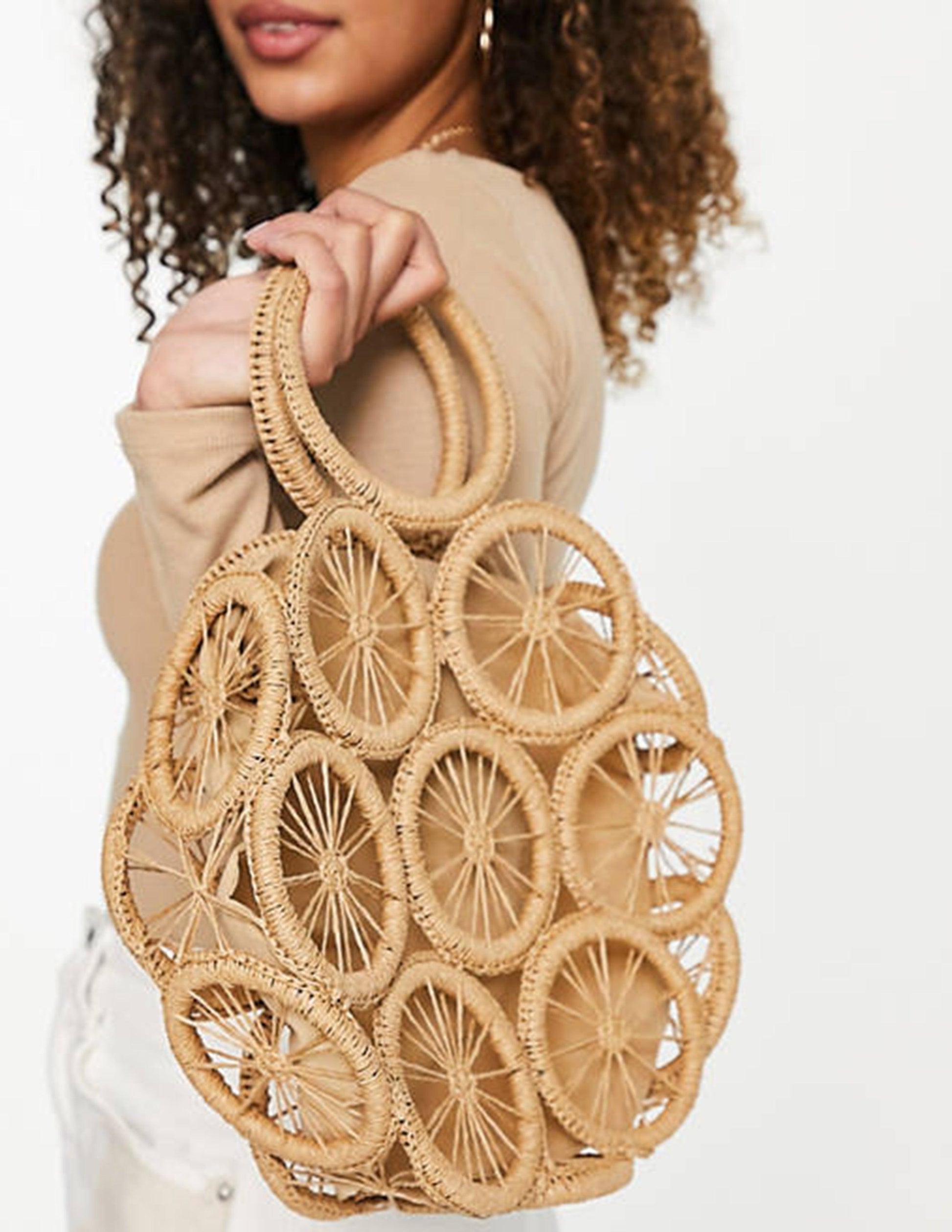 Natural woven straw beach tote bag with durable handles, roomy silhouette for summer outings