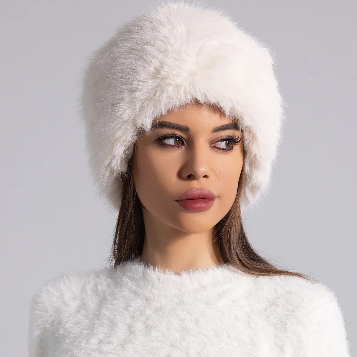 Women's ivory plush round fur hat full-coverage winter style with cozy luxurious texture