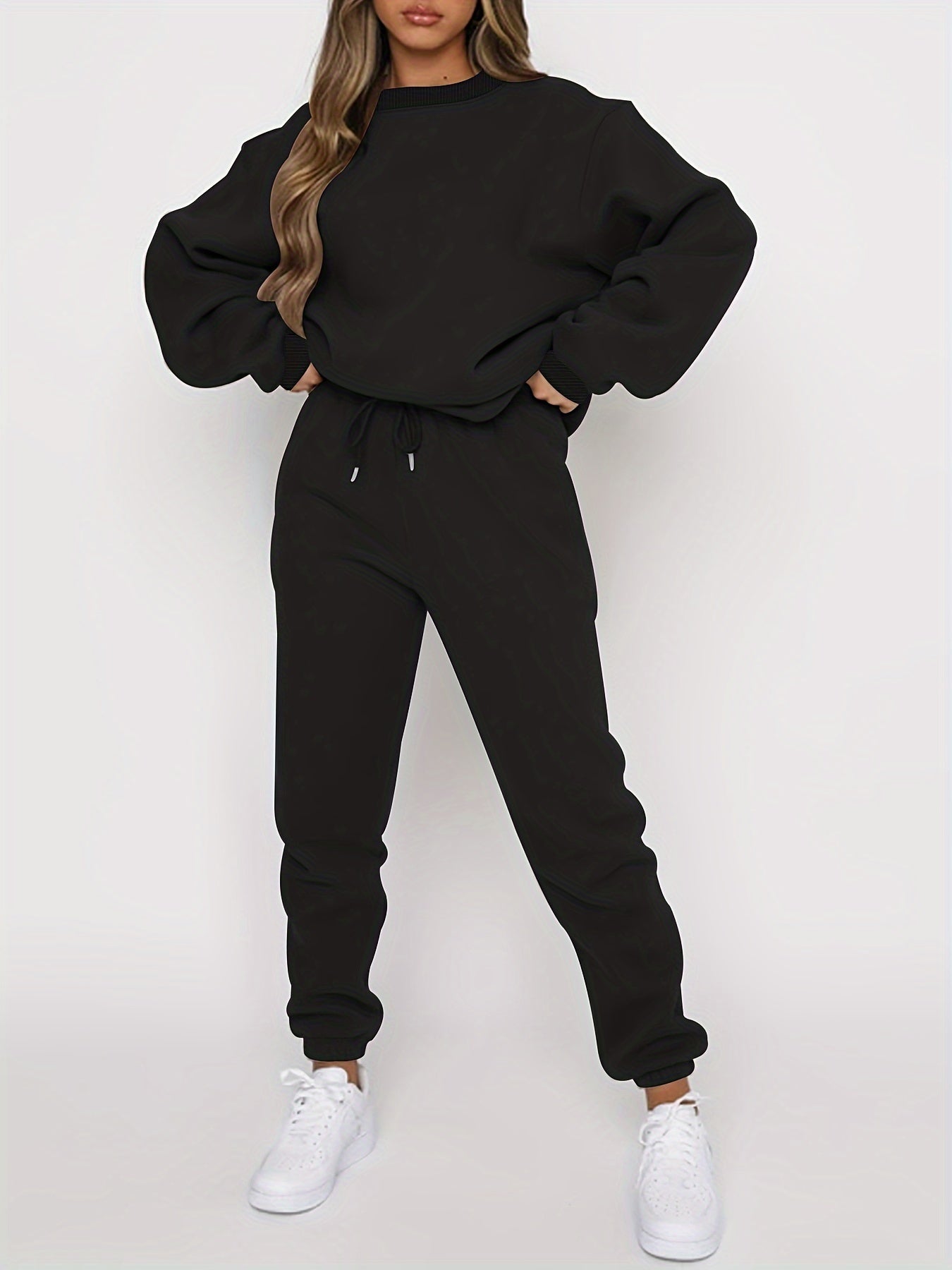 Women's cozy jogging set featuring oversized sweatshirt and high-waisted joggers for casual comfort