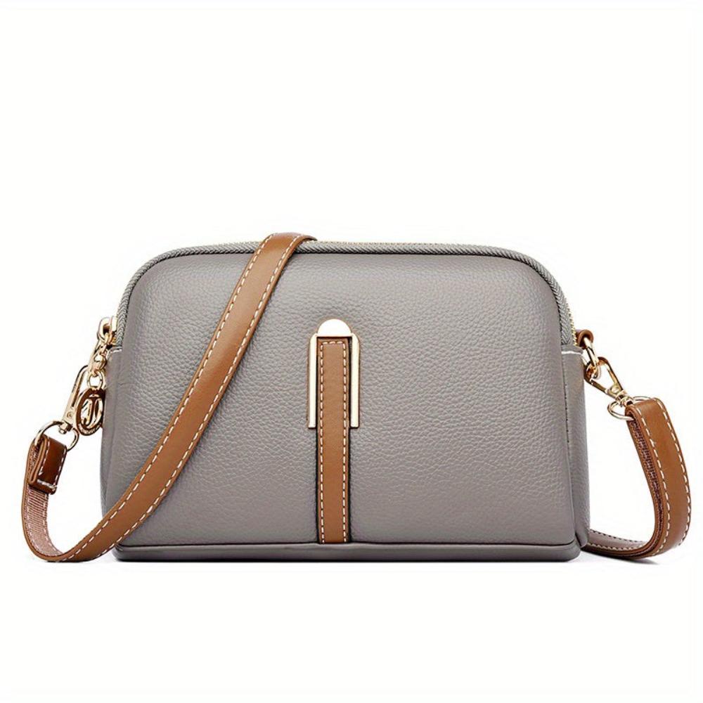 Elaine black vegan leather women's crossbody bag with gold-tone zipper and adjustable strap