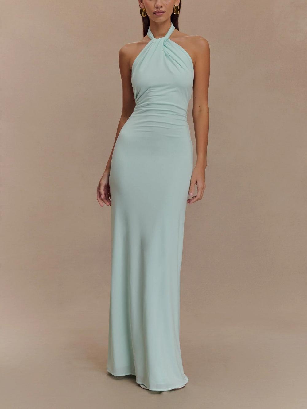Brown slinky halter maxi dress with ruched front and low back, curve-skimming elegant silhouette