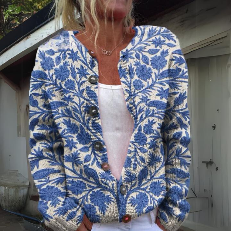 Women's floral print knit cardigan in warm tones, button-up silhouette with stretchy wool blend comfort