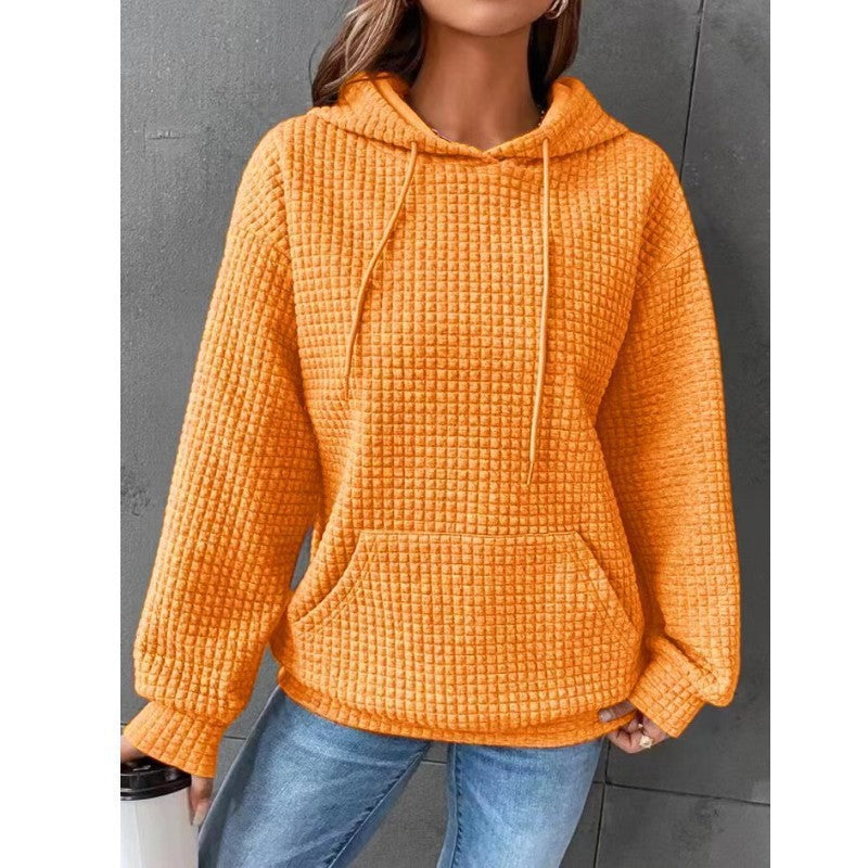 Women's loose fit hoodie with kangaroo pocket in soft textured fabric for casual everyday comfort