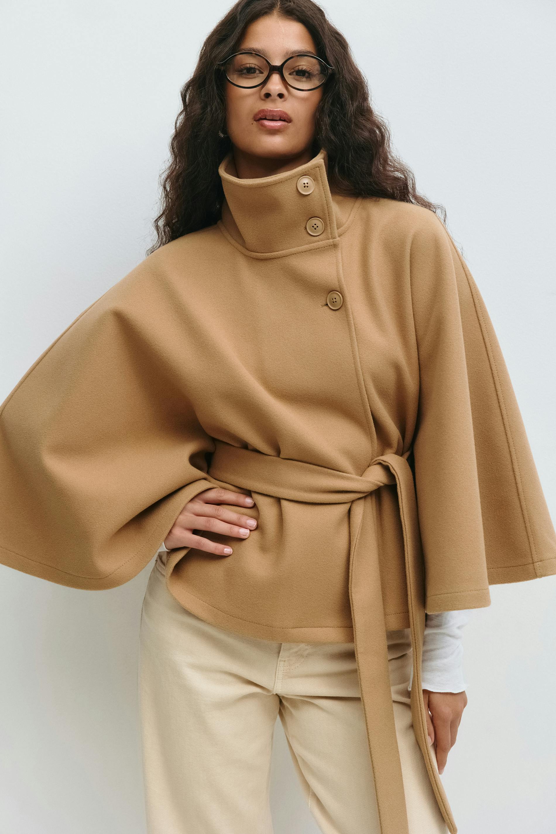 Women's belted winter cape coat with high collar, flowing silhouette, cozy lightweight warmth