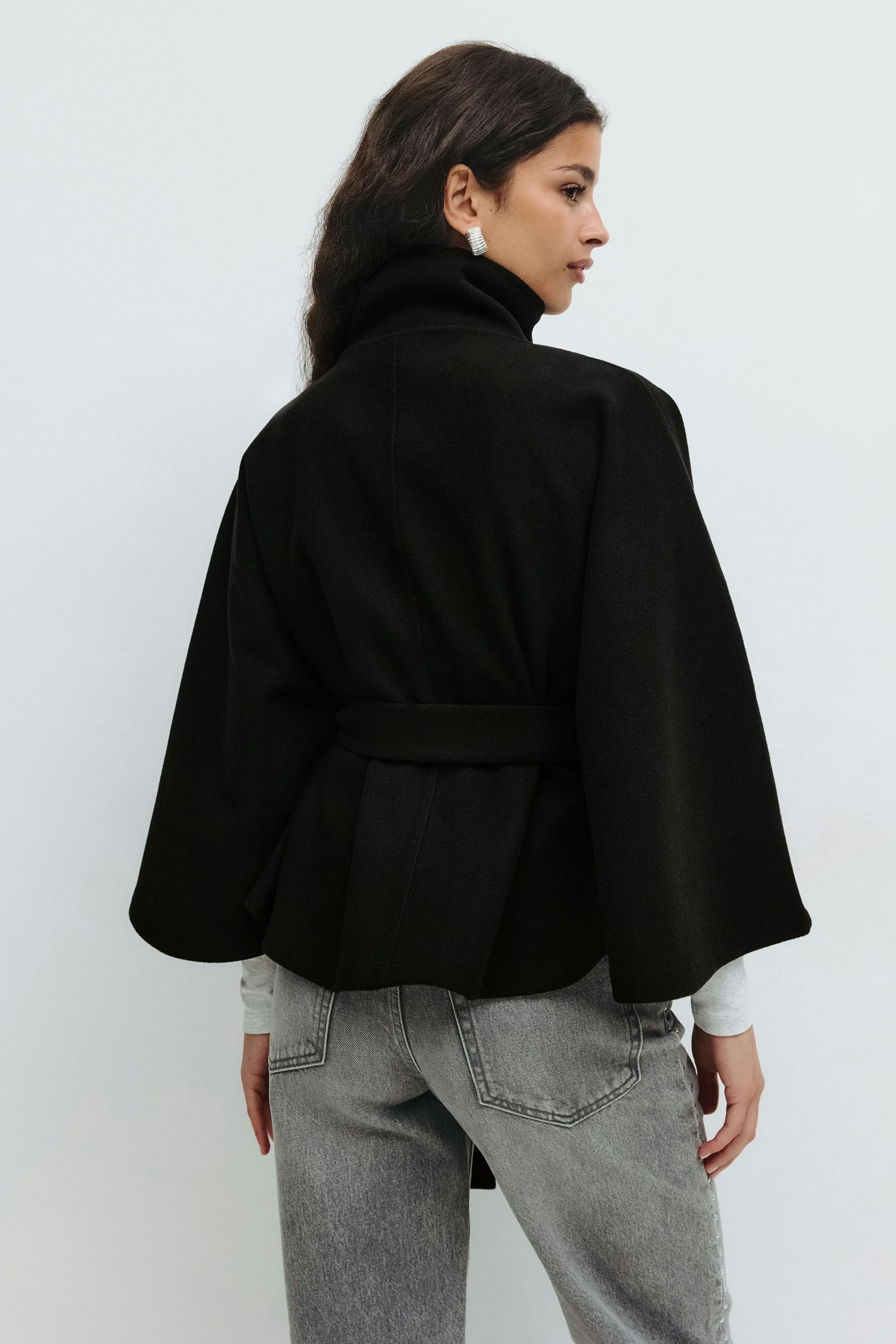 Women's belted winter cape coat with high collar, flowing silhouette in cozy lightweight fabric