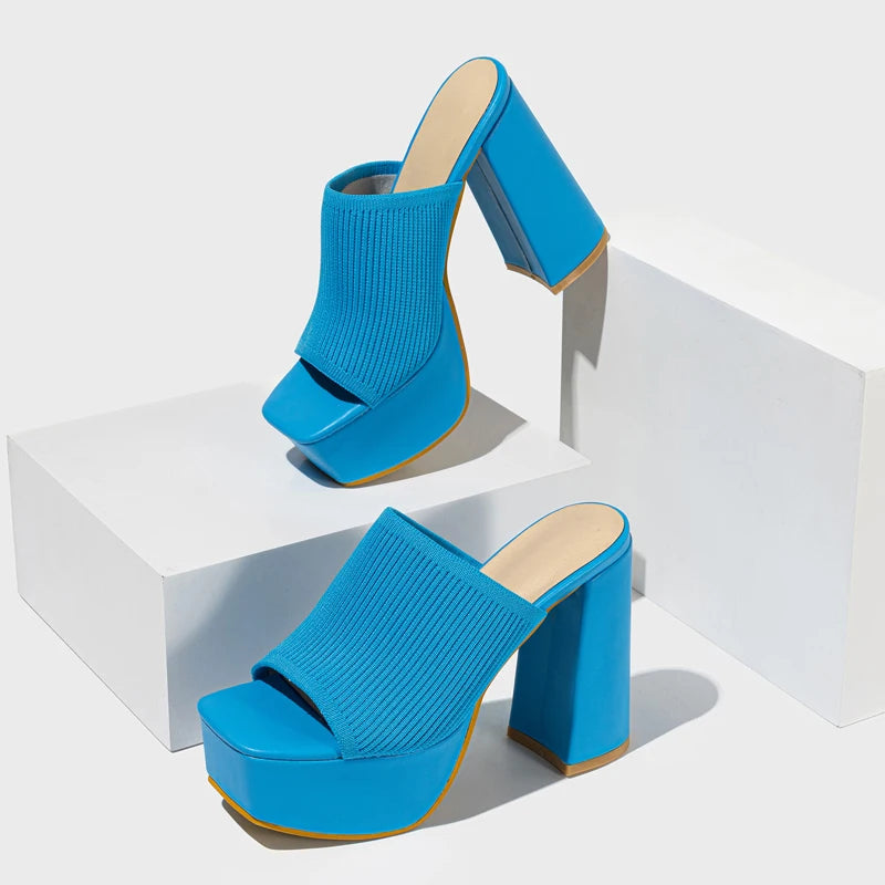 Bold neon stretch ribbed knit platform mule heel with sky-high block heel and snug flexible fit