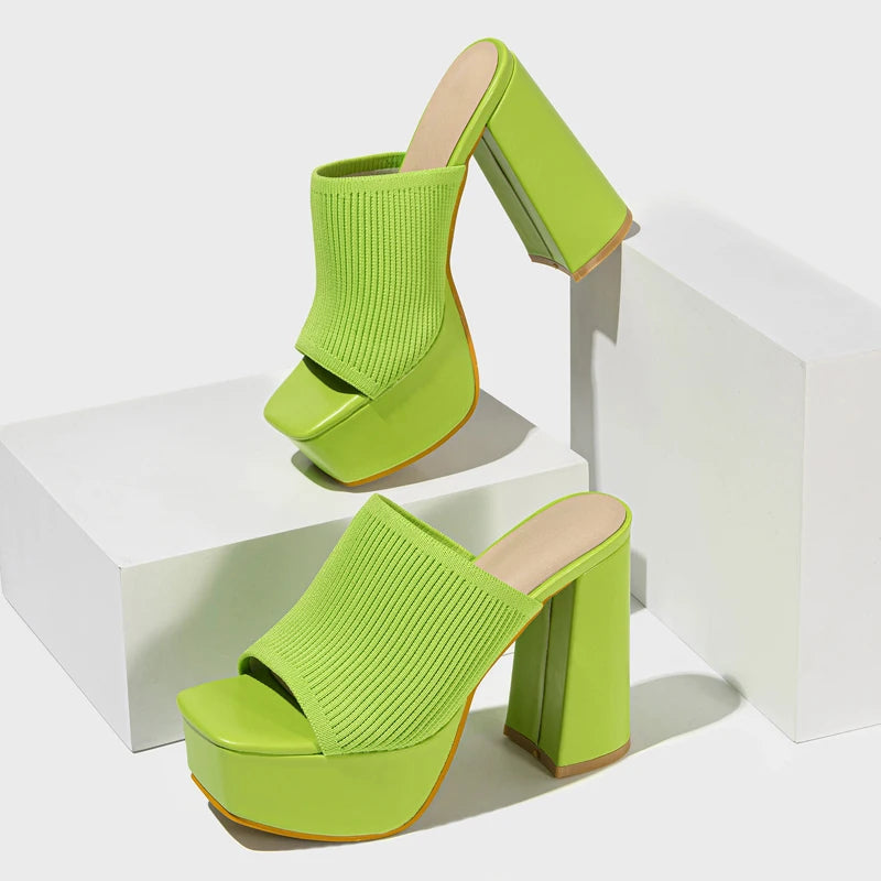 Bold neon stretch ribbed knit platform mule heel with sky-high block heel and snug fit