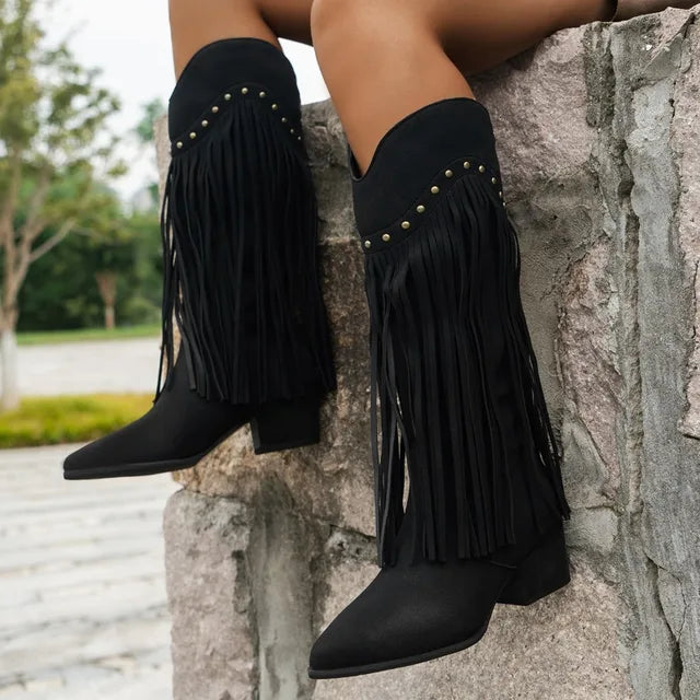 Women's brown knee-high Western fringe boots with sleek elongating shaft and flowing fringe detail