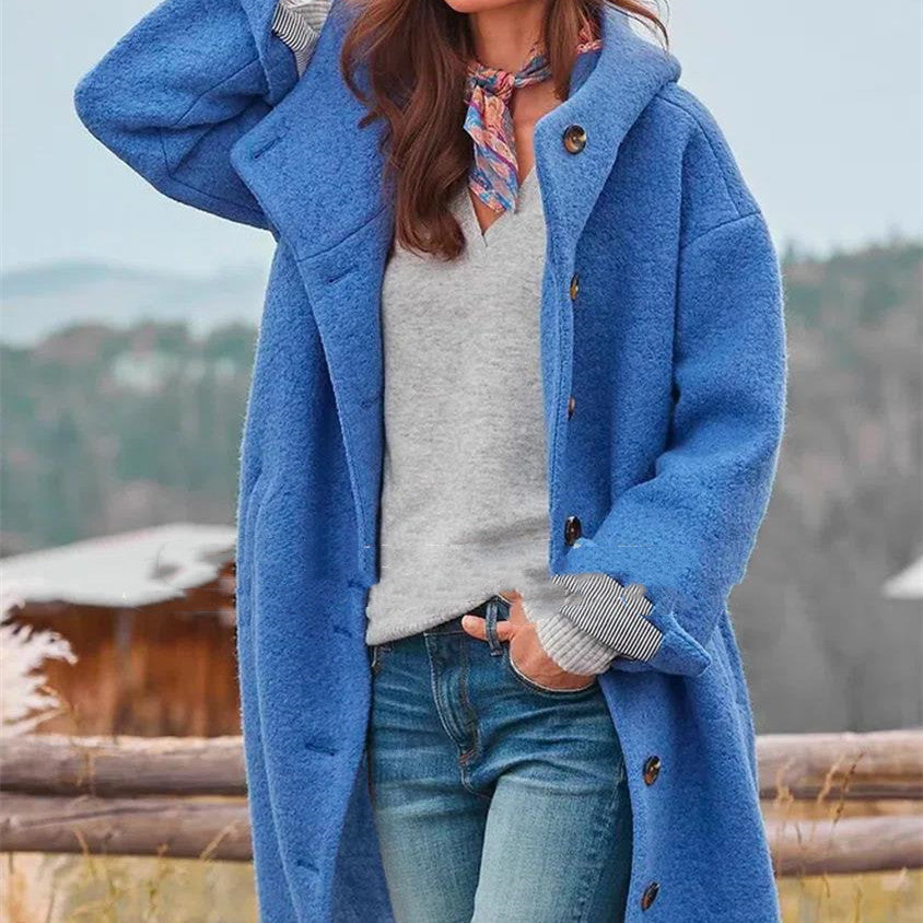 Women's oversized wool coat in bold blue with loose silhouette and front button closure