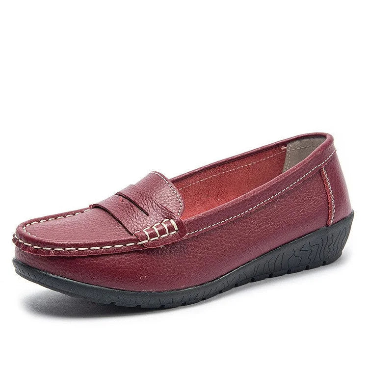 Women's black genuine leather slip-on loafers with cushioned PU lining and flexible rubber sole