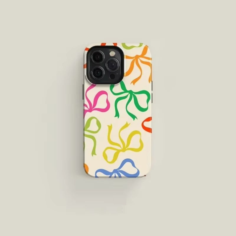 Black bow-pattern iPhone case slim glossy finish elegant couture design robust everyday protection