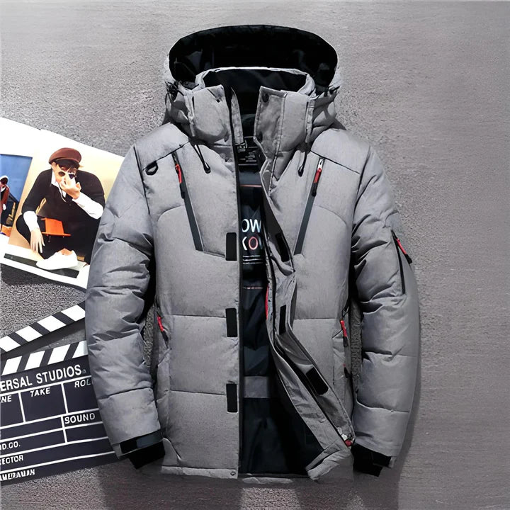 Men's navy blue hooded puffer jacket with longer cut silhouette and secure zipper pockets