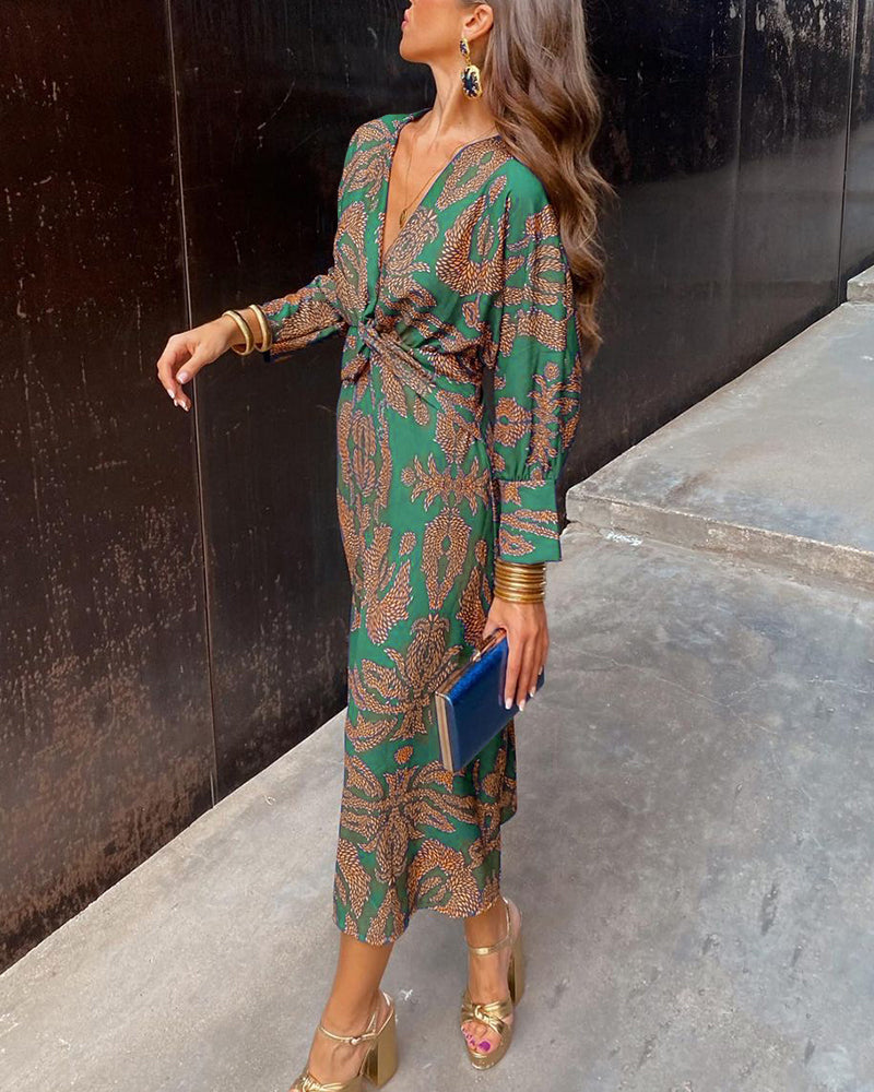 Violet printed A-line maxi dress with V-neckline, knotted front, and graceful drape for wedding guests