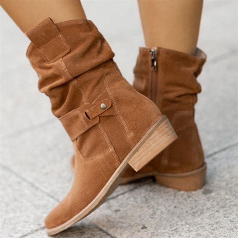 Women's black slouchy mid-calf boots with pointed toe, buckle strap detail, and relaxed everyday silhouette