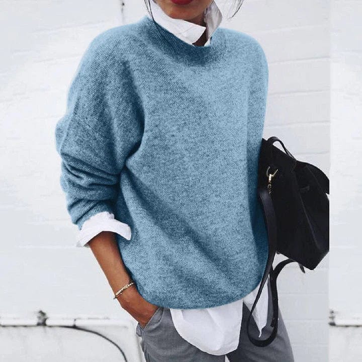 Relaxed crewneck knit sweater in neutral tone, soft texture, versatile layering piece for everyday minimalist style