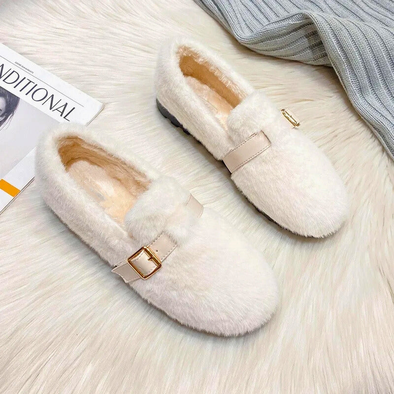Women's cozy flat shoes with plush faux fur exterior and cushioned lining for stylish warmth