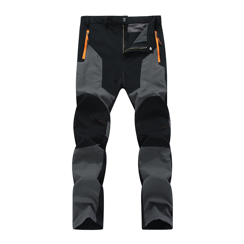 Men's dark waterproof work pants fleece-lined with reinforced friction zones for cold weather job sites