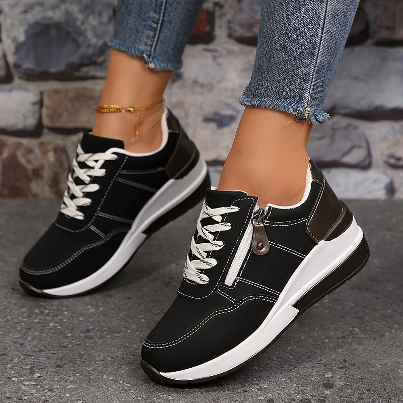 White urban sneakers with sleek sporty silhouette and cushioned sole for all-day city comfort