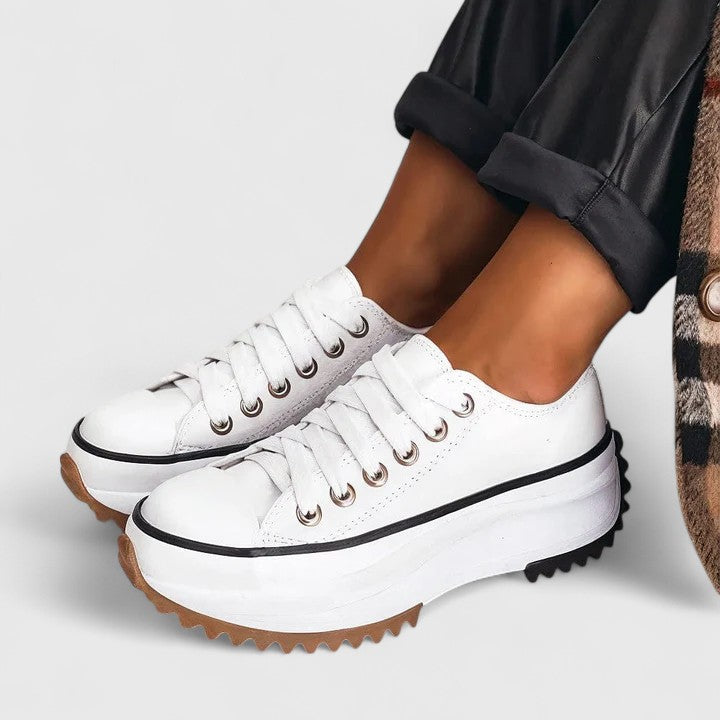 White canvas platform lace-up sneakers with chunky thick sole and rounded contrast toe
