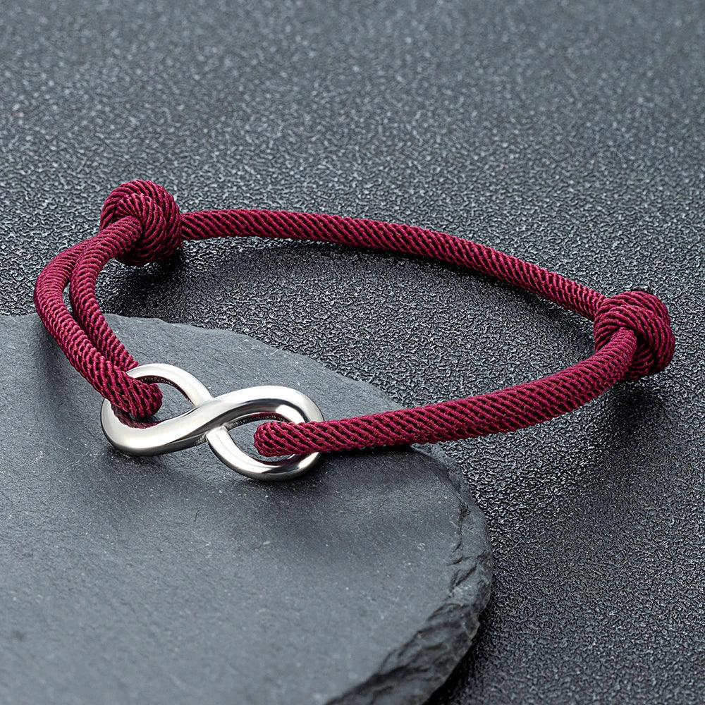 Adjustable braided cord bracelet with stainless steel infinity charm minimalist unisex everyday style