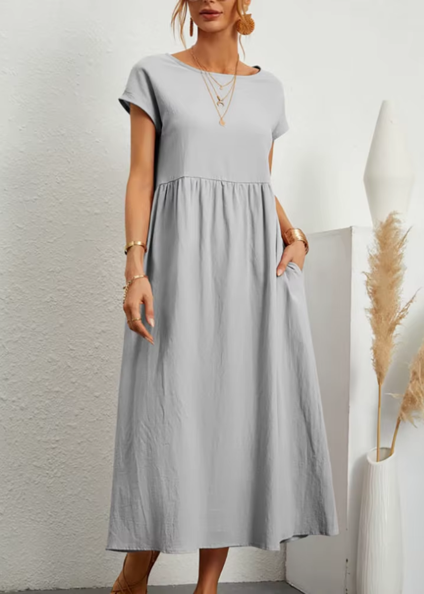 Women's relaxed midi dress with gathered waist, soft short sleeves, flowy silhouette and pockets