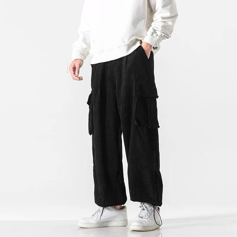 Unisex corduroy pants with drawstring waist, relaxed fit, and oversized pockets for everyday comfort