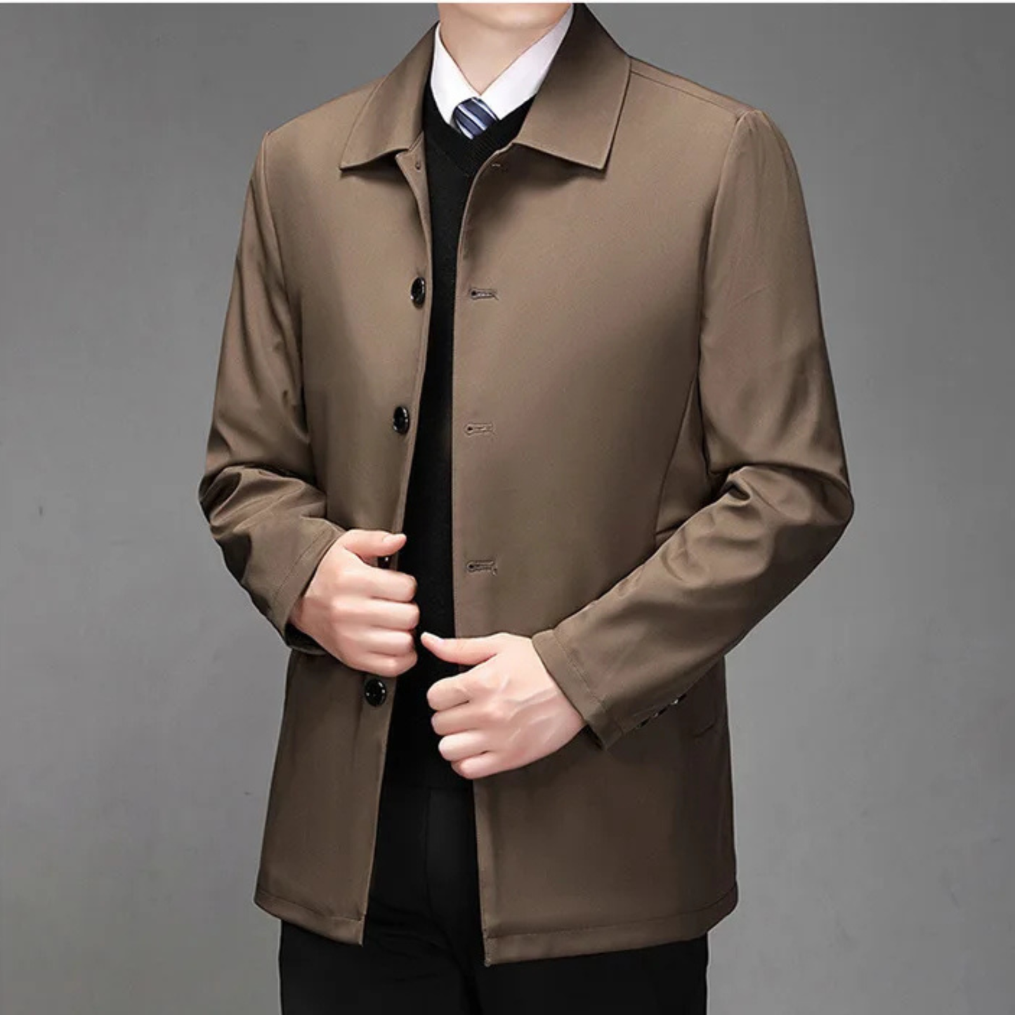 Charcoal tailored professional coat with crisp drape, structured shoulders, and wrinkle-resistant finish
