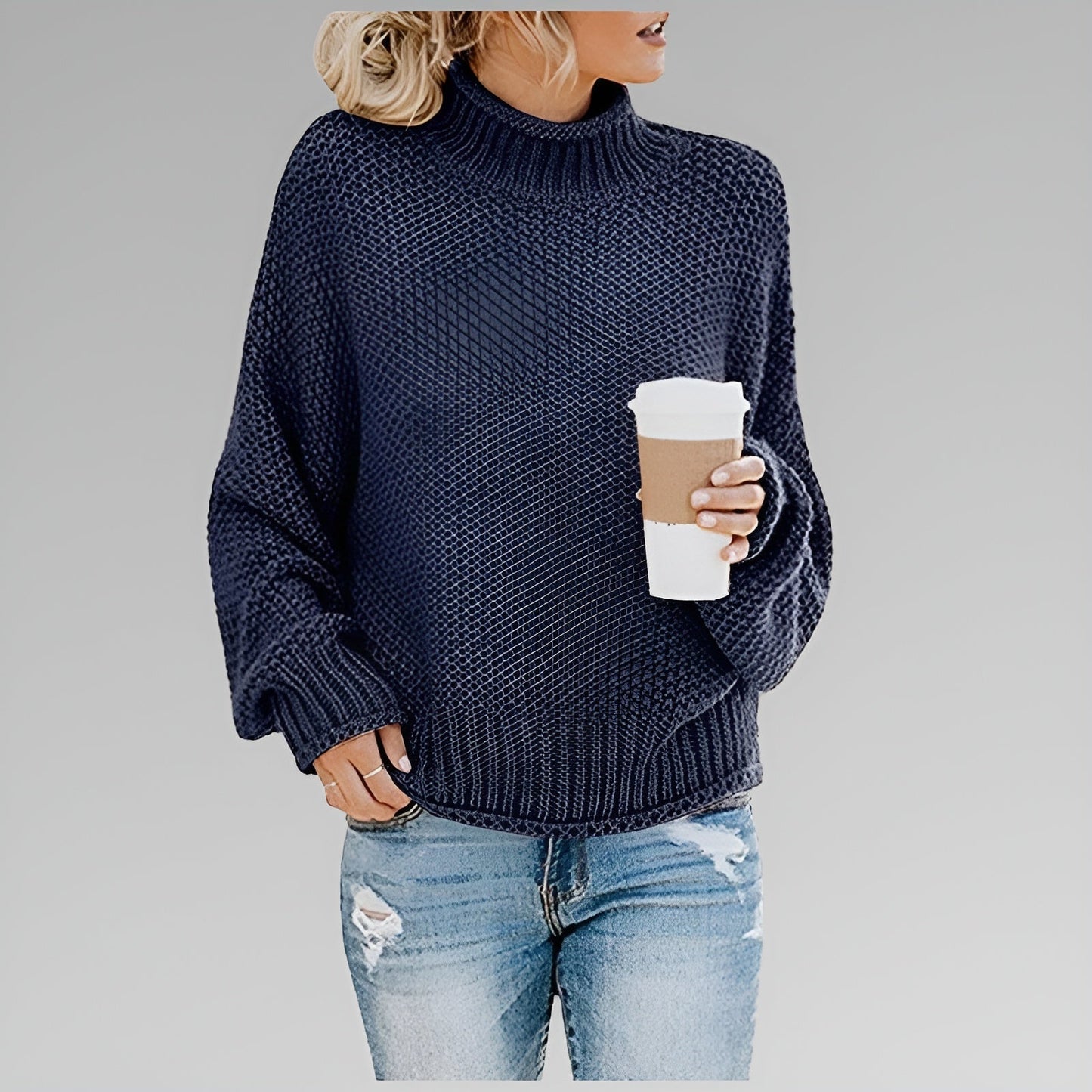 Women's cream chunky knit oversized sweater with textured ribbed pattern for cozy casual style