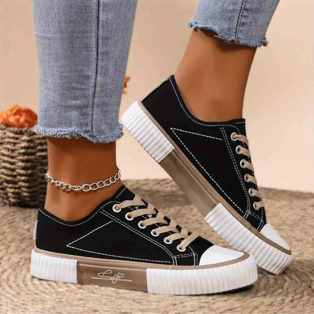 Women's white canvas sneakers lightweight breathable design with arch support and streamlined silhouette