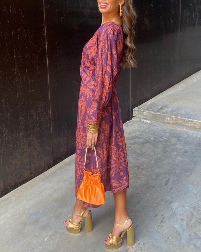 Violet printed A-line maxi dress with V-neckline and knotted front drape for wedding guests