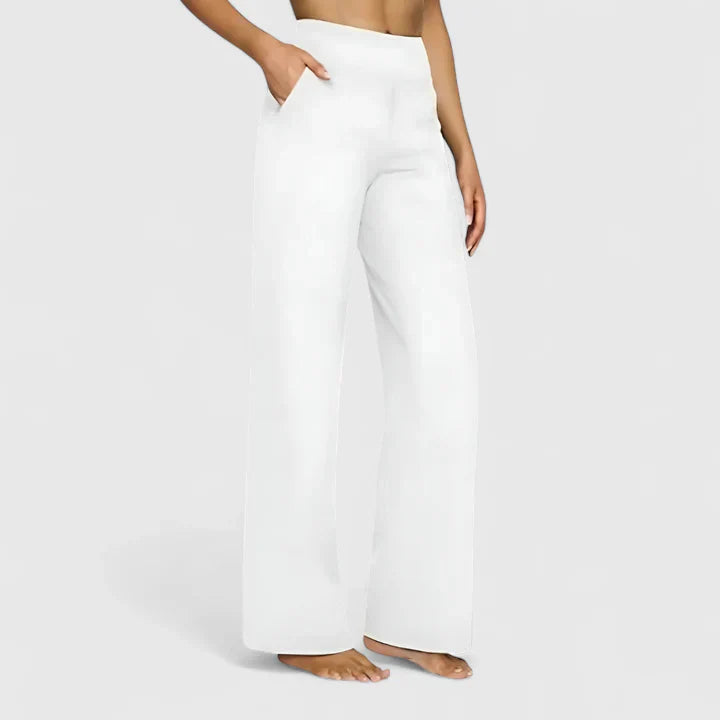 Women's high waist wide leg pants in neutral tone, flowing silhouette for effortless chic workwear style
