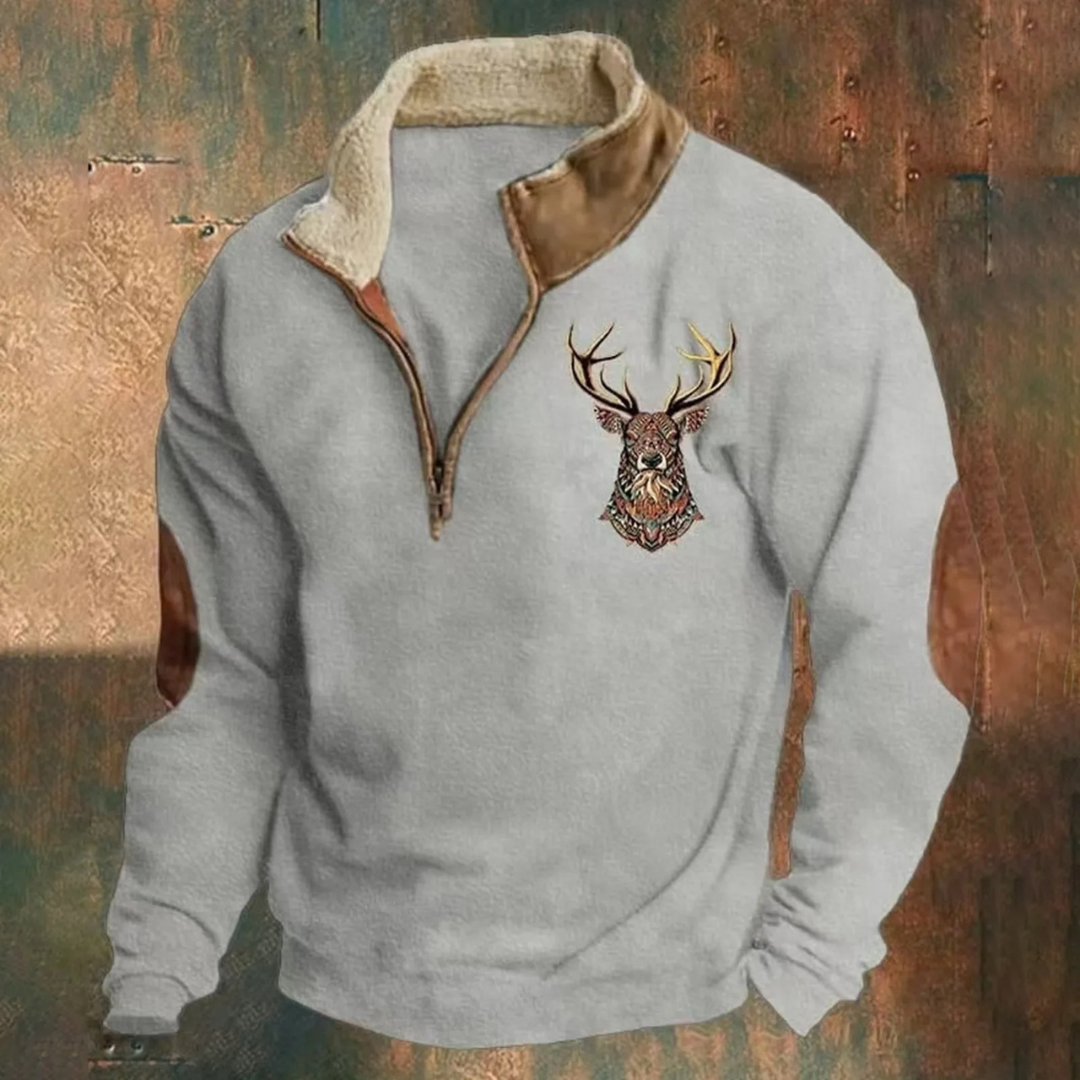 Men's brown half-zip pullover with embroidered deer detail, brushed interior, outdoor adventure style