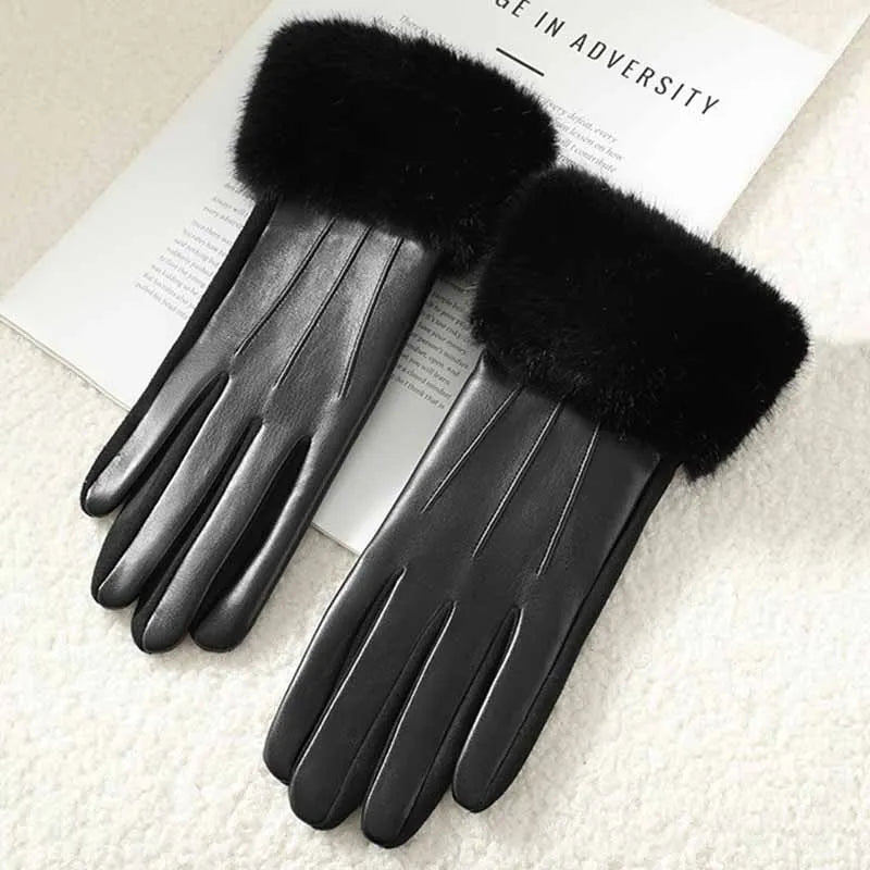 Women's black faux leather gloves with fluffy faux fur cuffs and touchscreen-compatible fingertips