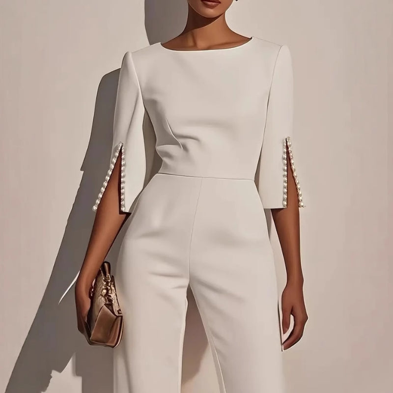 Ivory wide-leg jumpsuit with pearl embellishments, boat neckline, split three-quarter sleeves