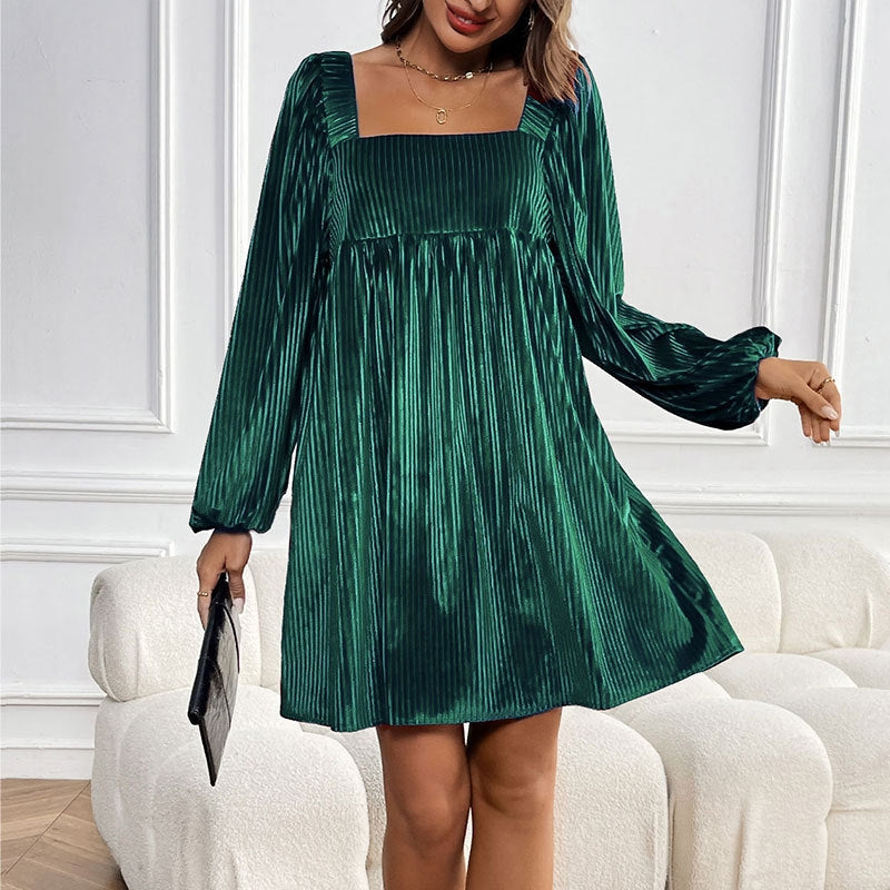 Emerald green velvet mini dress with structured square neckline and vertical pleats for nights out