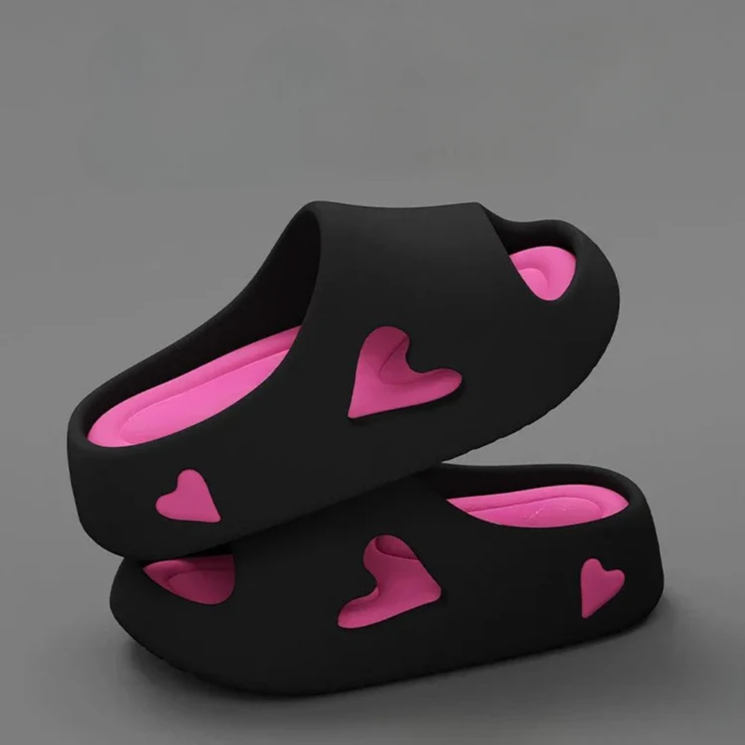 Women's ultra-light EVA foam slides with playful heart cutout details for all-day casual comfort