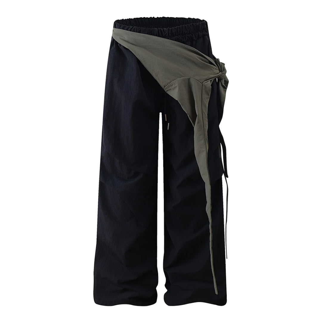 Black wide-leg cargo trousers water-repellent nylon relaxed fit with adjustable lace-up overlay