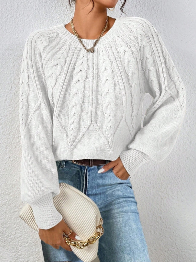 Women's cream cable knit cropped sweater with balloon sleeves and elongating silhouette