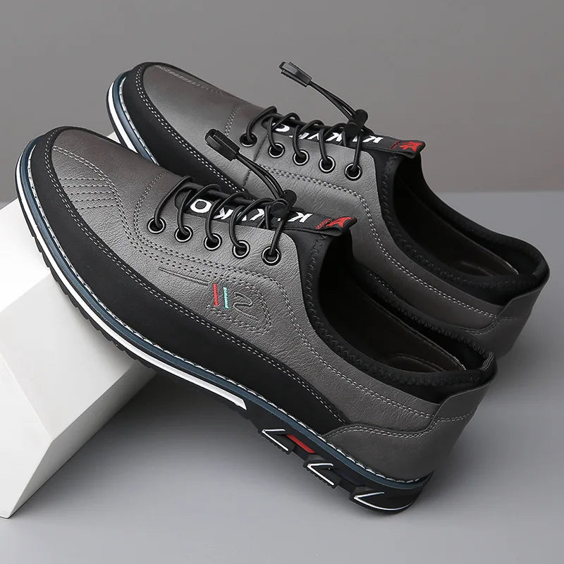 Men's low-profile PU leather sneakers with textile upper and supportive structured outsole for daily wear