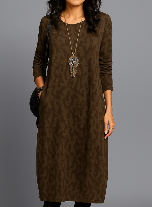Women's casual midi dress with long sleeves, side pockets, and patterned hem detail for everyday elegant comfort