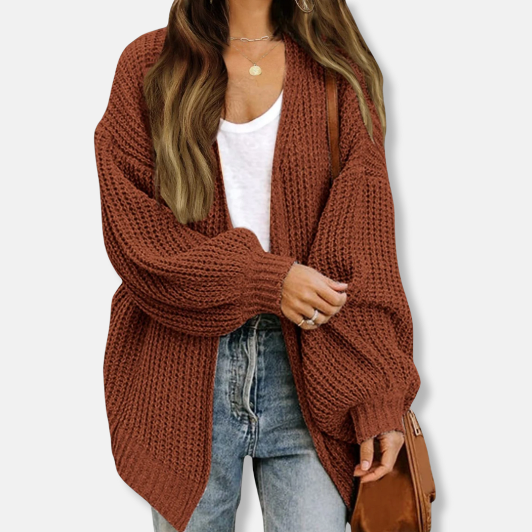 Women's oversized knit cardigan with voluminous lantern sleeves and ribbed cuffs for chic layering