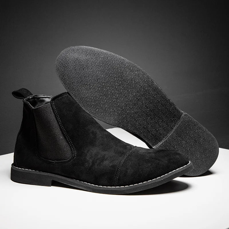 Men's tan suede Chelsea boots with elastic side panels, polished finish, and lightweight rubber sole