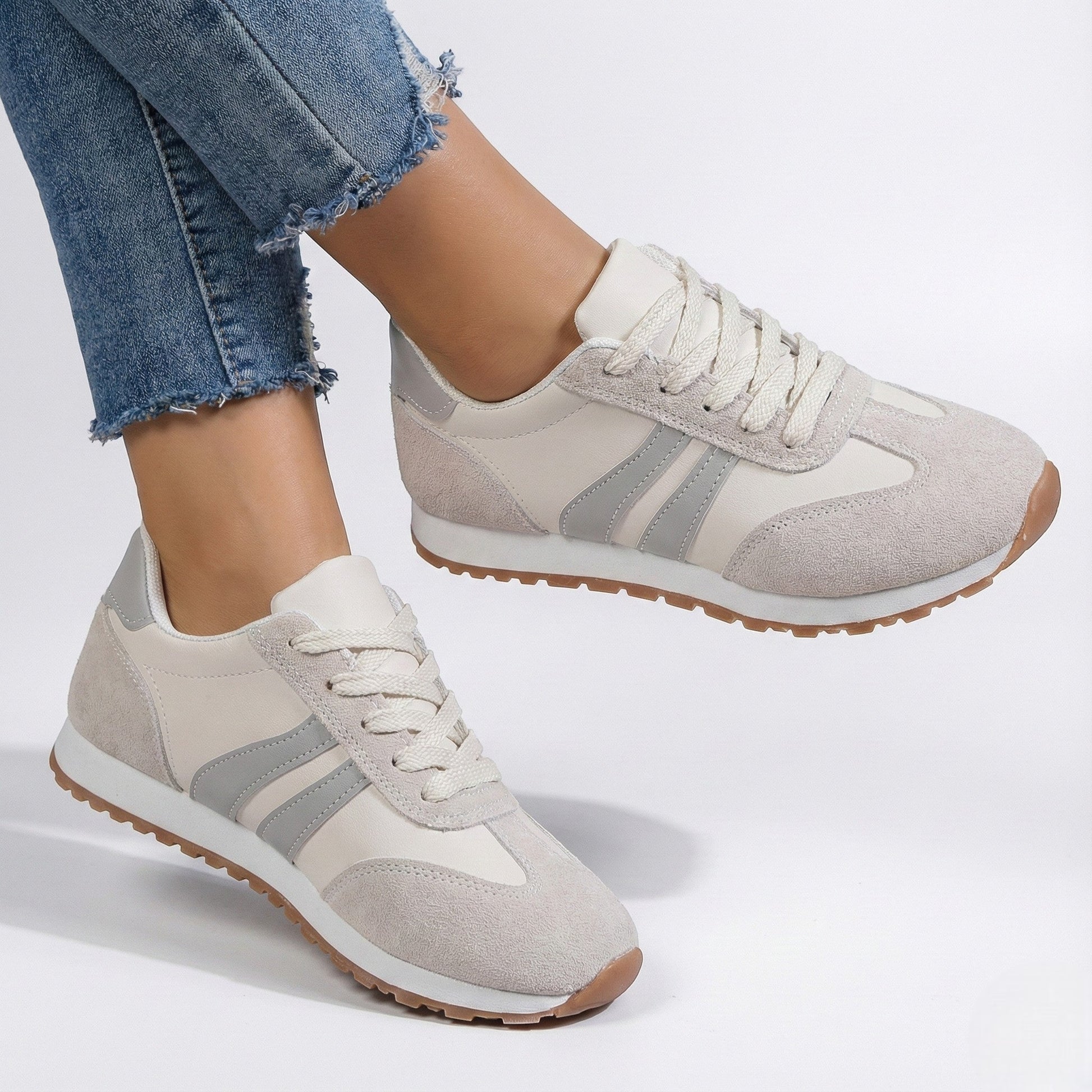 Women's white orthopaedic sneakers with ergonomic arch support and cushioned lightweight sole
