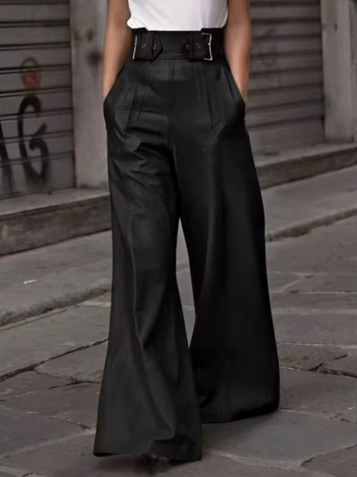 Women's black high-waisted soft leather pleated pants with pockets, elegant streetwear silhouette