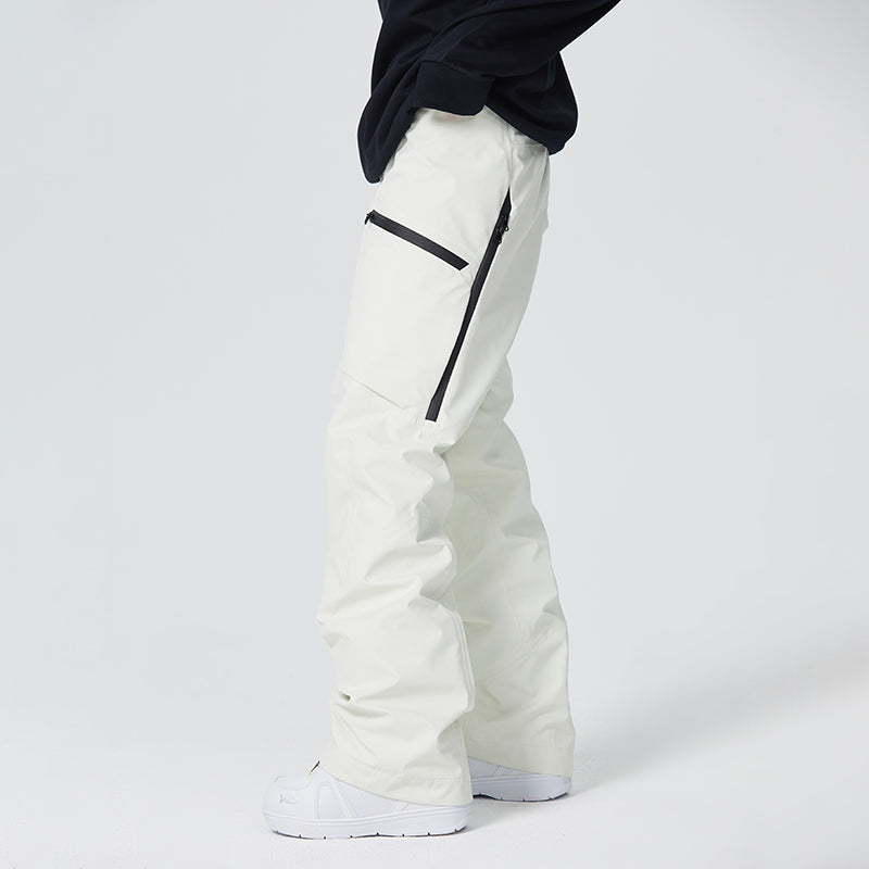 Women's waterproof snow pants in black with thigh vents, boot gaiters, and fully taped seams for skiing