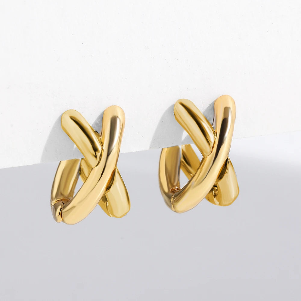 Xyla bold architectural double-band crossover hoop earrings with high-polish finish for modern minimalists